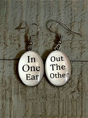 ‘In One Ear / Out The Other' White Glass Dangle Earrings